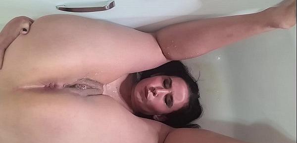  Piss whore pissing over her face in the bathtub